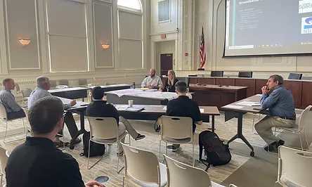 People presenting at a meeting