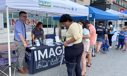 People at an Imagine 2050 event booth