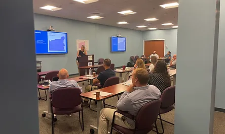 Person presenting at a meeting